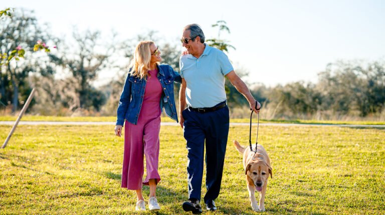 Fenced dog park with open grass at Valencia Golf & Country Club, Naples FL