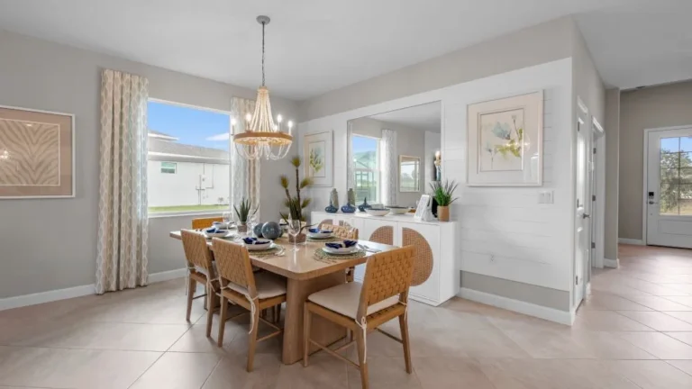 The dining area — one space with the kitchen and family room in the Trevi at Valencia Golf & Country Club, Naples FL