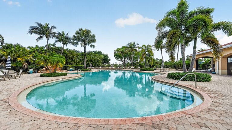 Loungers on the pool deck at Valencia Golf & Country Club, Naples FL