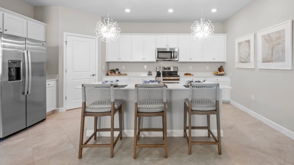 Kitchen and island in a new Lennar home at Valencia Golf & Country Club in Naples, Florida